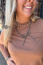Load image into Gallery viewer, Wild West Bow Necklace

